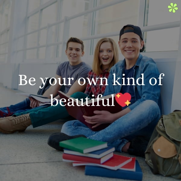 200+ Boy Instagram Captions To Highlight Confidence And Style 2 Three people sitting on the ground, smiling, with the words "be your own kind of beautiful" written above them.