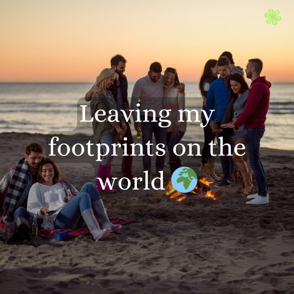 A group of people sitting around a bonfire on the beach, enjoying the warmth and company, with the words "leaving my footprints on the world."