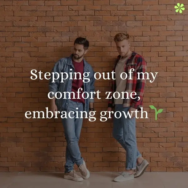 Two men standing by a brick wall, embracing growth as they step out of their comfort zone.