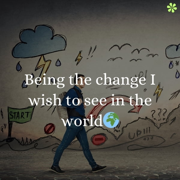 200+ Boy Instagram Captions To Highlight Confidence And Style 3 A person holding a sign that says "being the change I wish to see in the world".