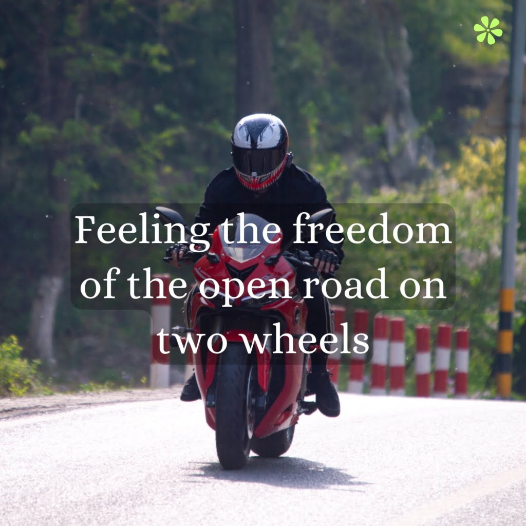 A person riding a motorcycle on a road, enjoying the freedom and thrill of the open journey ahead.