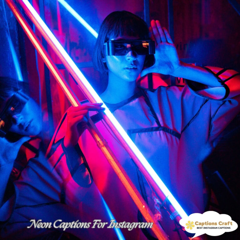 A person striking a pose in neon lighting, wearing stylish sunglasses with vibrant blue and pink hues.