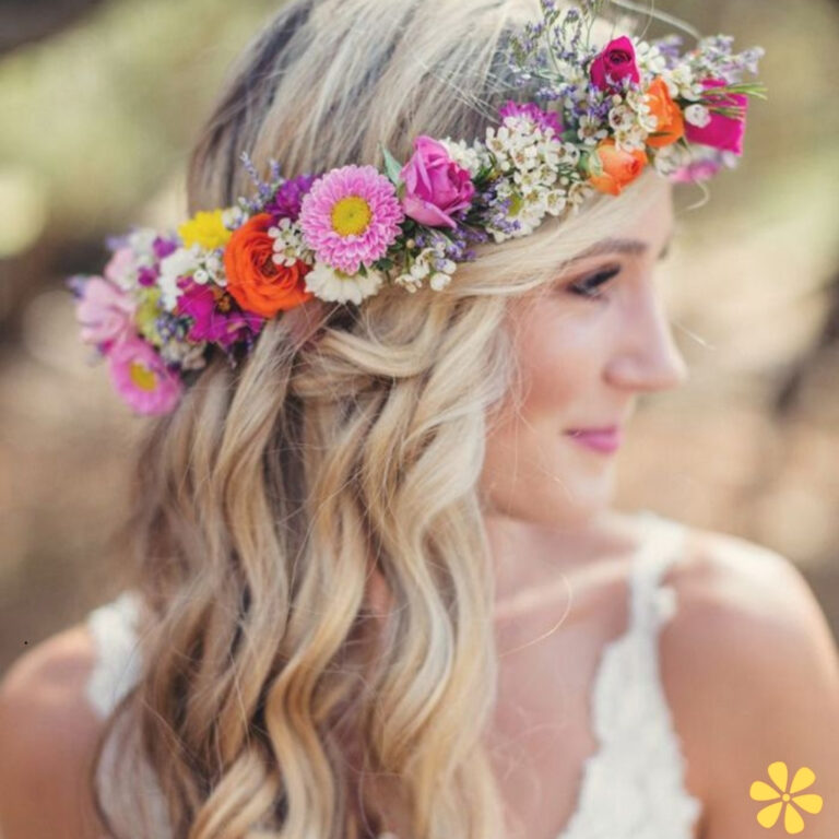A woman with flowing blonde hair adorned with a vibrant flower crown.
