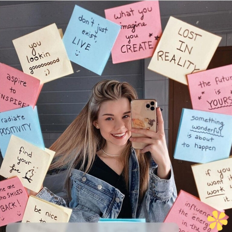 Young woman smiling with sticky notes around her, promoting positivity and creativity.