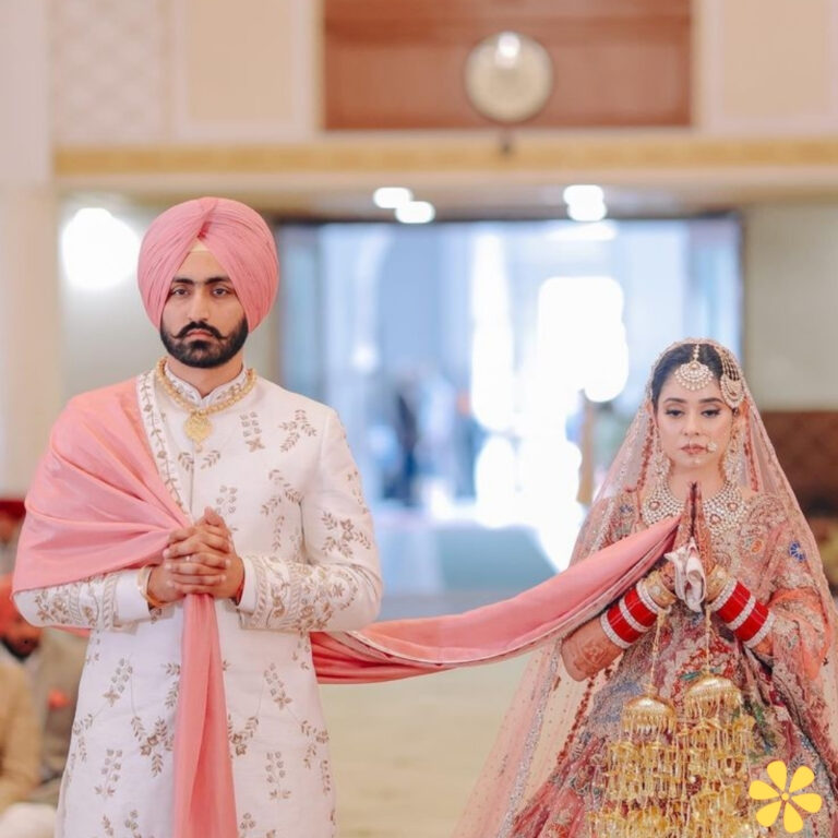 Bride and groom walking together, dressed in traditional attire.