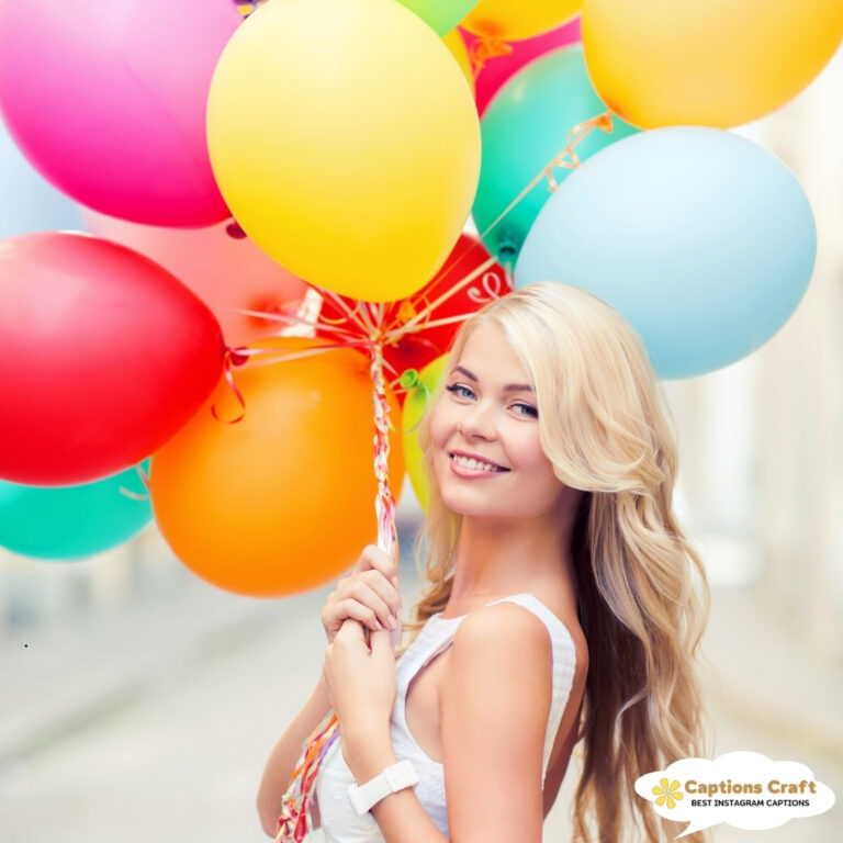 Woman smiling with colorful balloons in hand.