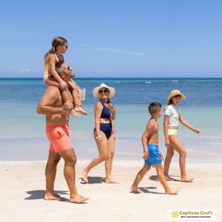Family enjoying a sunny day at the beach, walking along the shoreline.