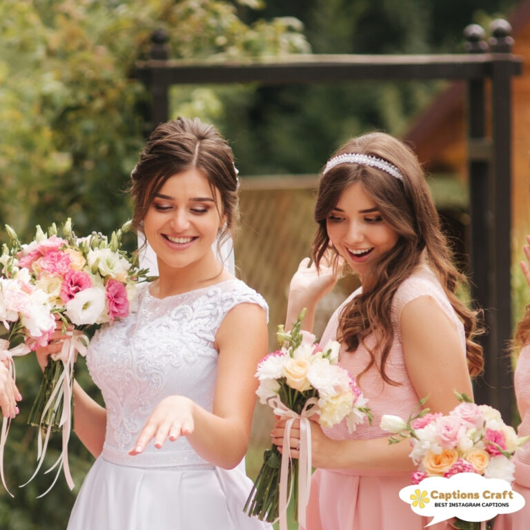 Two bridesmaids admiring a ring while holding bouquets of flowers.
