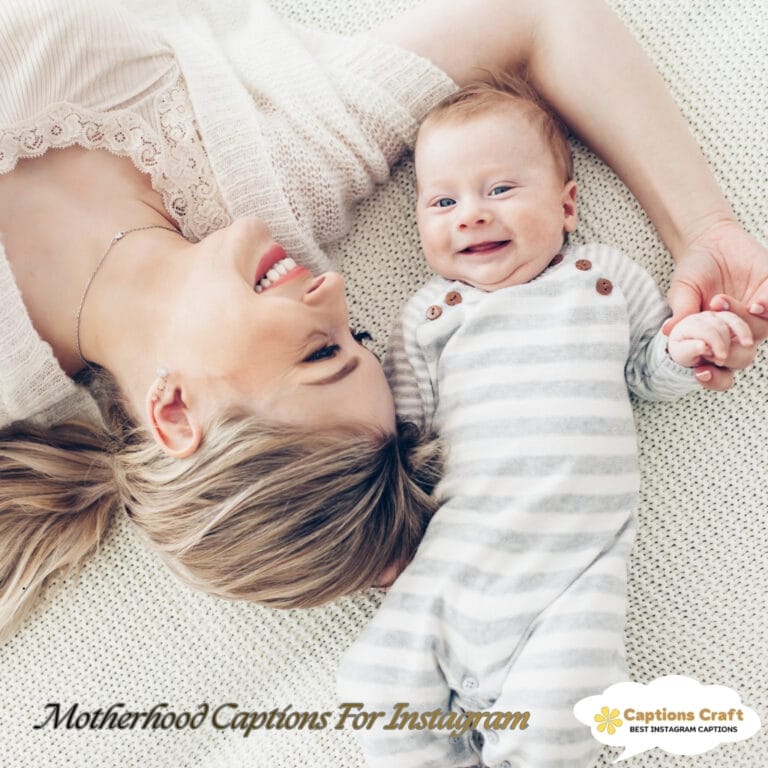 A mother and her smiling baby lie on a soft surface, sharing a joyful moment together.