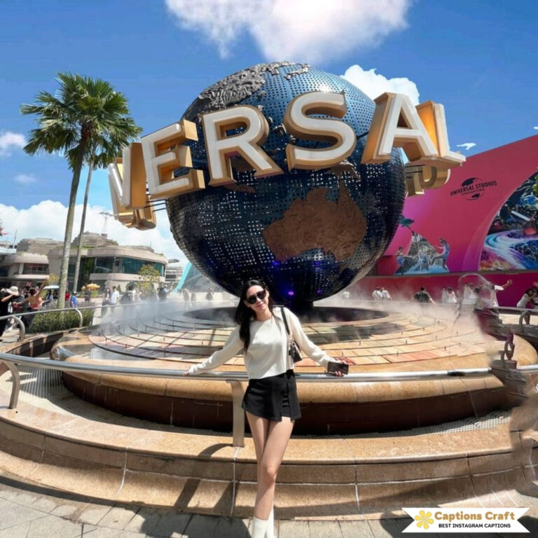 Person poses with a large globe and the word 'UNIVERSAL' in the background.